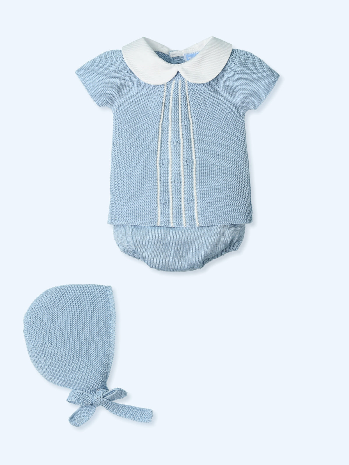 Baby boy four-piece blue knitted outfit with Peter Pan collar top, matching shorts, bonnet, and booties from Mac Ilusion Spring Summer collection.