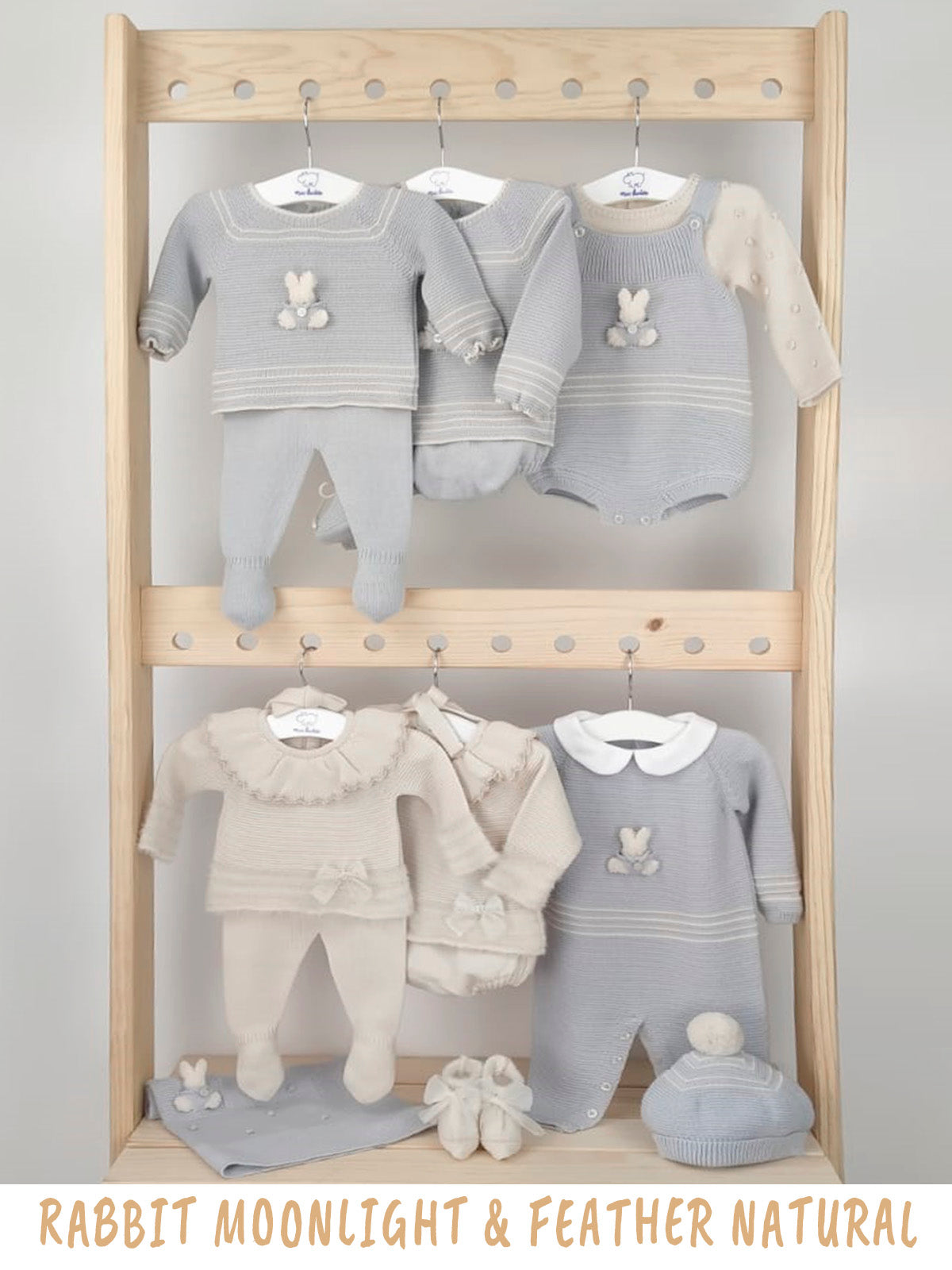 Baby clothing set on a wooden rack with 'Rabbit Moonlight & Feather Natural' text.