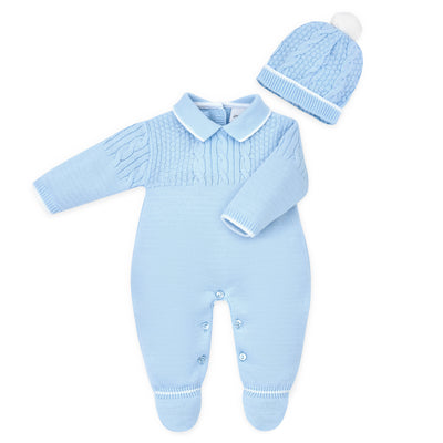 This new arrival from Dandelion is perfect for your little boy. Its cosy, knitted design features a unique combination of cable and basket weave patterns, ensuring both style and comfort. Made in Portugal from 100% acrylic, and featuring a collar and 5 button fastening, this onesie and bobble hat combo is a must-have. Available in sizes newborn, 0-3 months and 3-6 months.