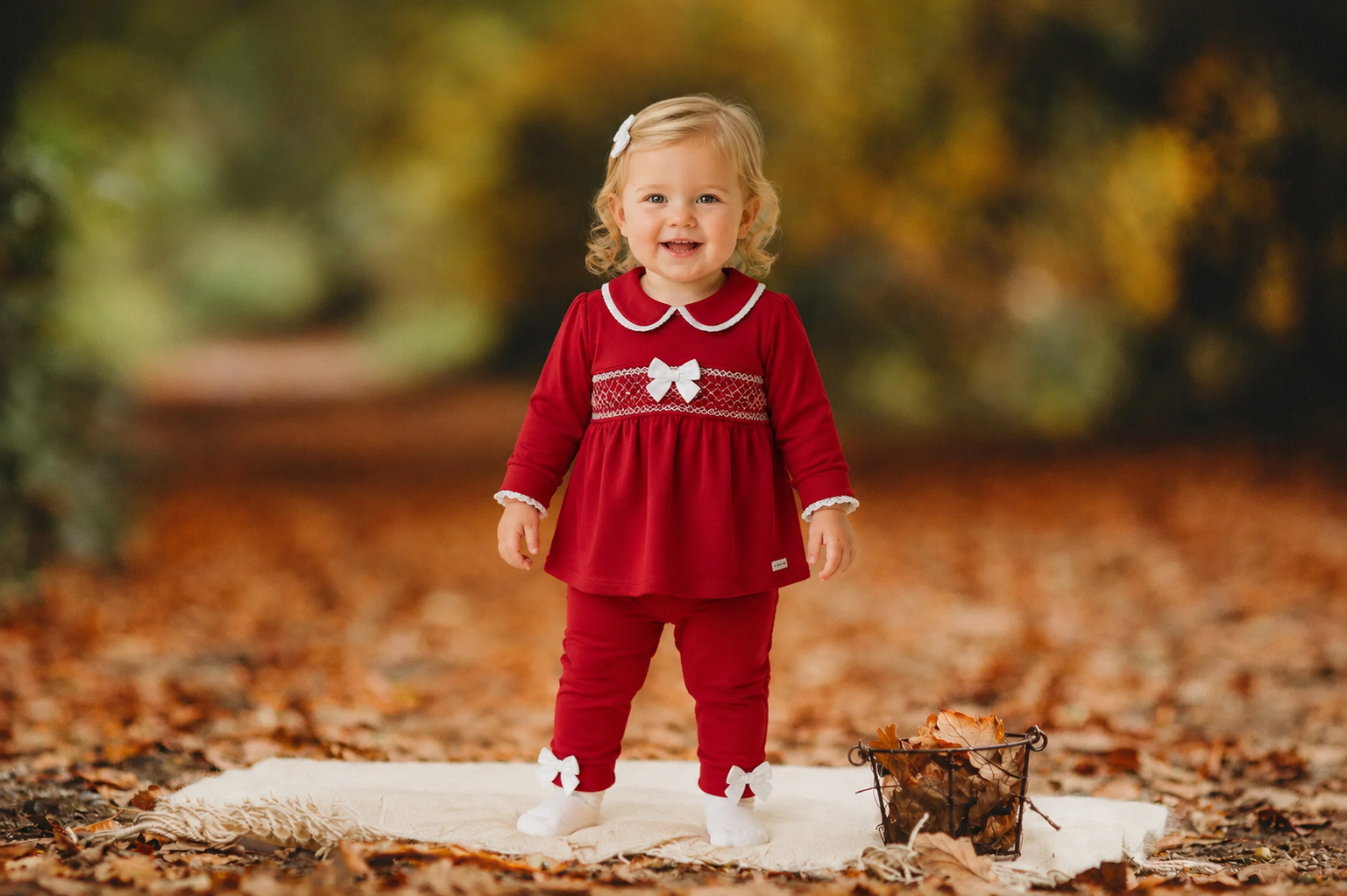 amore girls red smocked top and leggings set model standing on autumn leaves luxury infant fashion