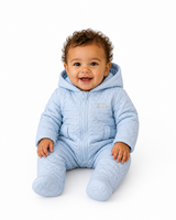 amore baby boys blue quilted snowsuit model sitting white background studio shoot heritage boutique childrenswear