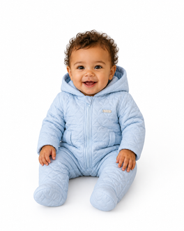 amore baby boys blue quilted snowsuit model sitting white background studio shoot heritage boutique childrenswear