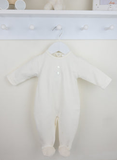 Traditional baby boys ivory long sleeved cotton sleepsuit by Pex with integrated feet for a boutique style finish