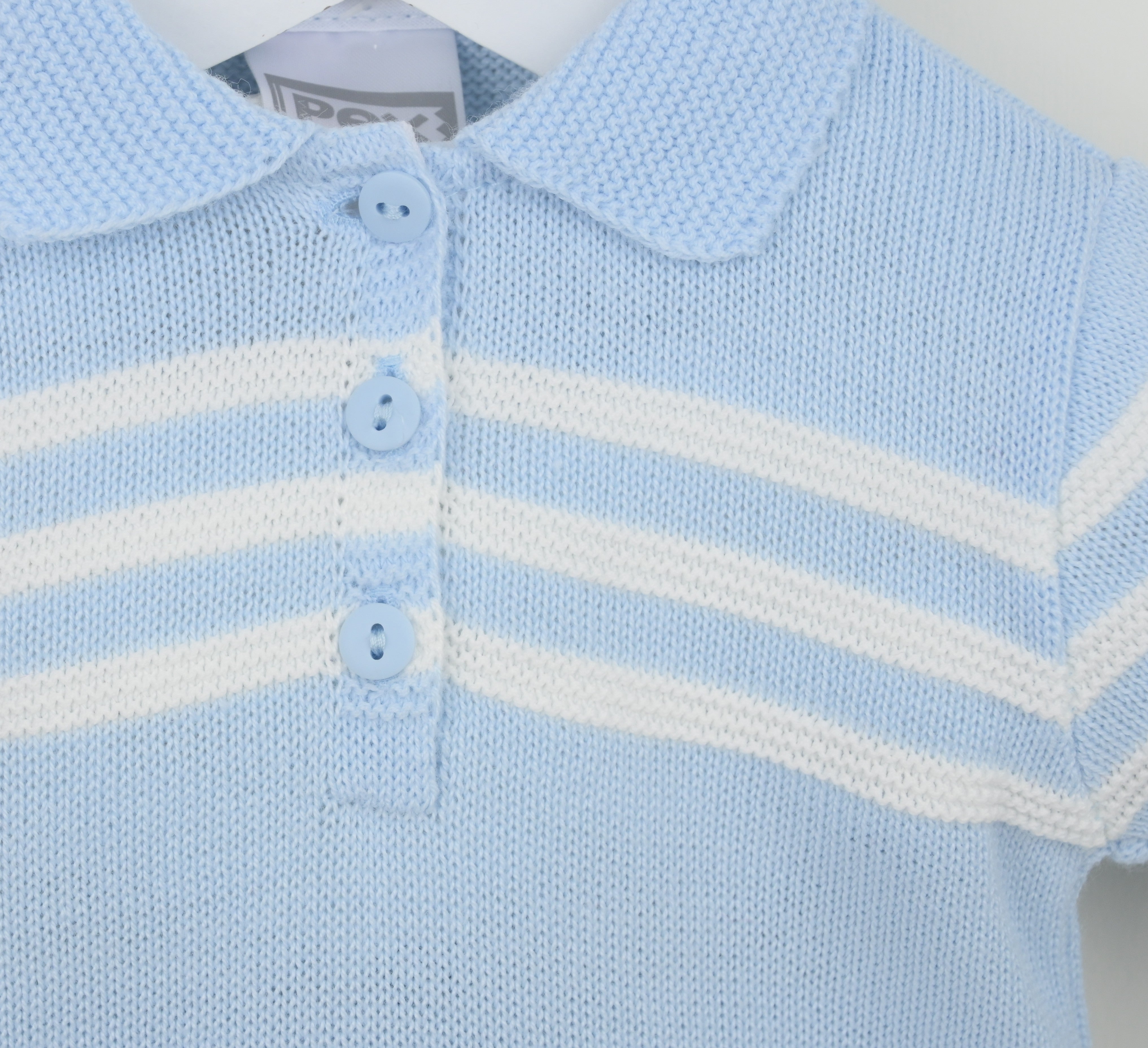 Detail of Pex Mateo boys blue knitted polo shirt with white stripe detailing smart summer occasion wear for kids