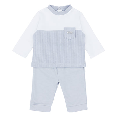 Blues Baby branded boys two piece jogger set finished in grey and white. This boys outfit consists of a long sleeve, round neck top, with cable design and a small pocket to the front. It also comes with grey trousers to match. Available in sizes 3 month up to 24 month.  Also available in baby blue colour.