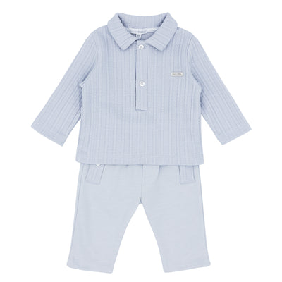 Blues Baby branded boys two piece polo shirt and trouser set finished in a soft grey colour. This two piece set consists of a long sleeve collared top with a cable jacquard design down the front. The trousers come with an elasticated waistband. Available in sizes 3 month up to 24 month.  Also available in sky blue.
