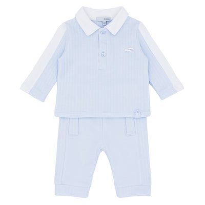 Blues Baby branded boys two piece jog set with vertical jacquard design and collar detail. This set is finished in a pastel blue and white colour. Available in sizes 3 month up to 24 month.