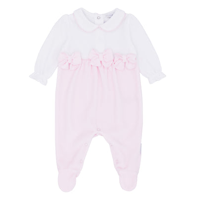 Blues Baby branded girls pink velour sleepsuit with satin bows and lace trims. This stunning little sleepsuit has cute small collars with push button fastening on the reverse. Available in sizes 1 month and 3 month.