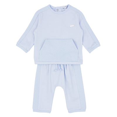 Introduce your little boy to the new season in style with our Blue Baby two piece jog suit. Part of our autumn winter collection, this outfit is perfect for any occasion. Made with our signature round neck top and trousers with matching detail, this branded set is available for boys aged 3 months up to 4 years.