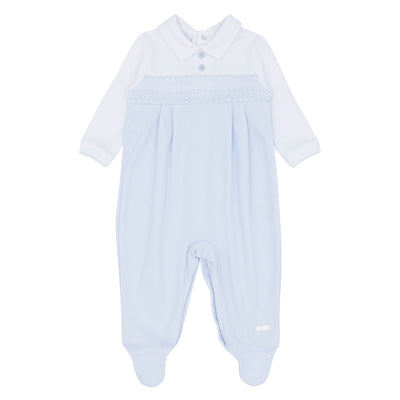 This baby boys blue &amp; white smocked all in one sleeper is perfect for newborns and babies up to 3 months old. The soft pastel blue and white colour combination is complemented by the smocked band across the chest and push button fastening on the reverse. Blues Baby branded for quality assurance.