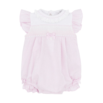 Experience the perfect combination of style and comfort with our Blues Baby branded girls pink &amp; white short sleeve smocked romper! Featuring a delicate smocked design with a charming ribbon bow, this romper will keep your little one looking cute and feeling cosy. With frills around the neck and elasticated around the legs, this romper offers a secure fit for your baby. Perfect for the spring/summer season, available in sizes 3 months up to 9 months.