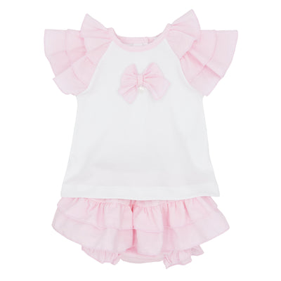 This two piece set from Blues Baby is perfect for your little girl's spring and summer wardrobe. The short sleeve white top features ruffle shoulders and a cute bow detail, while the pink bloomer shorts add a pop of color. Available in sizes 3 months to 24 months.