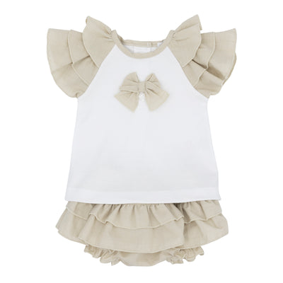 Introduce a beautiful addition to your child's spring and summer collection with Blues Baby's two-piece set. The white top showcases ruffle shoulders in beige and a charming bow accent, complemented by bow-adorned beige bloomer shorts that add a burst of colour. Available in a range of sizes from 3 months to 24 months.