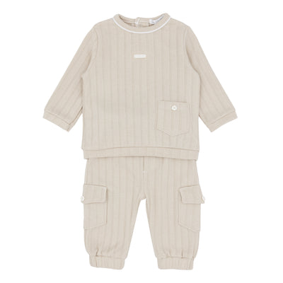 Introduce your young one to both fashion and comfort with our boys' beige two-piece top and cargo style jogger set. This top-of-the-line outfit by Blues Baby showcases a front pocket design on the long sleeve top and an elasticated waistband for the cargo style joggers. Ideal for coordinating with siblings, and offered in sizes ranging from 3 months to 4 years. Newly introduced for our spring/summer collection, this set exudes both practicality and style.