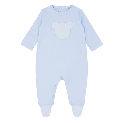 Blues Baby branded Baby Boys Sleepsuit finished in a pale blue colour. It has bear appliqué detail to the front and bottom. Round neck collar with push button fastening. This cute little babygrow is available in sizes newborn, 1m &amp; 3m.

100% Cotton