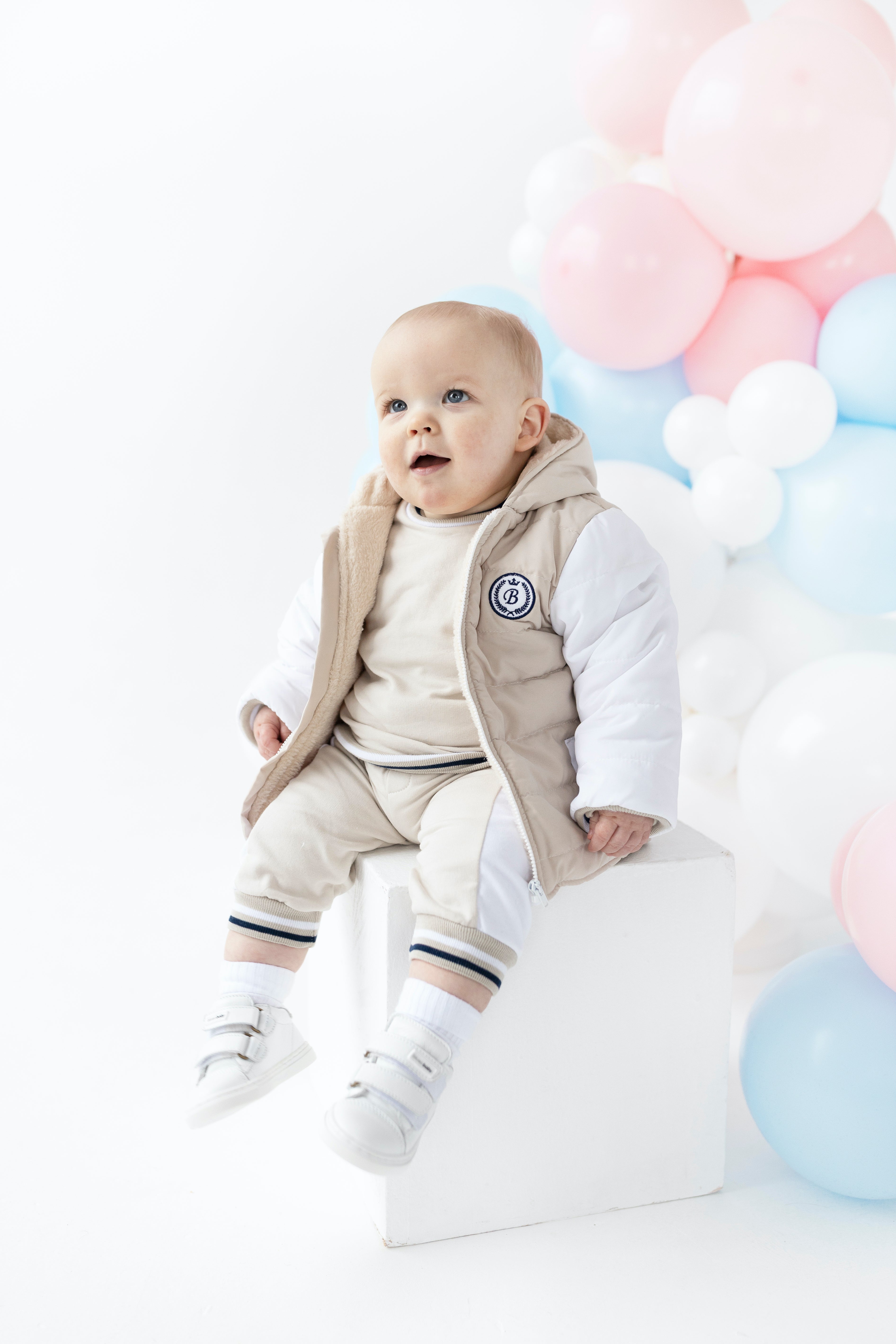 Beige jacket with hood and navy trim for boys