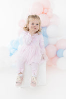 blues baby girls pink helsinki tutu dress and legging set sitting model heritage childrenswear luxury kids fashion