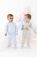 blues baby boys light blue hamel tracksuit model standing left beside beige polo set luxury kids fashion