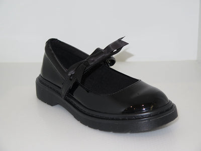 Our girls' black patent school shoes with velcro fastening are a must-have for school days – combining ease, elegance, and comfort. Crafted from glossy faux leather, these shoes feature a classic Mary Jane shape with a chunky, durable sole for long-lasting wear.

The stylish oversized grosgrain bow on the strap is removable, allowing your little one to choose between smart and sweet depending on the day. Please ensure to adjust or remove the bow using the loop on the strap, rather than pulling it directly, 