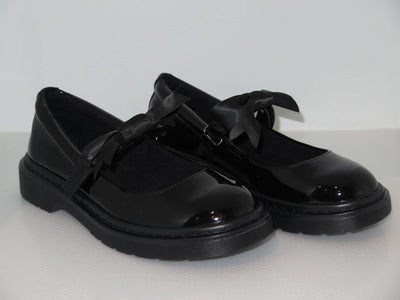 Side view of girls black patent school shoes with chunky sole and velcro fastening
