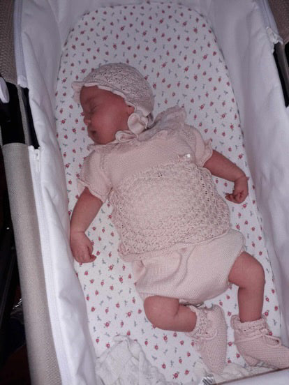 Happy child wearing Mac Ilusion outfit, showcasing adorable Spanish boutique baby clothing.