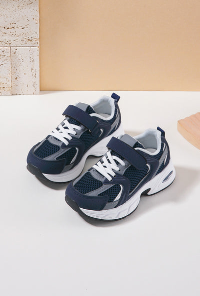 <p data-mce-fragment="1">Upgrade your child's shoe game with our navy blue chunky sole fashion trainers. These designer inspired trainers feature a chunky sole and stylish modern design. With both shoe lace fastening and a velcro strap, they're perfect for boys and girls. Elevate their outfits and provide comfort with these fashion-forward trainers.</p>
