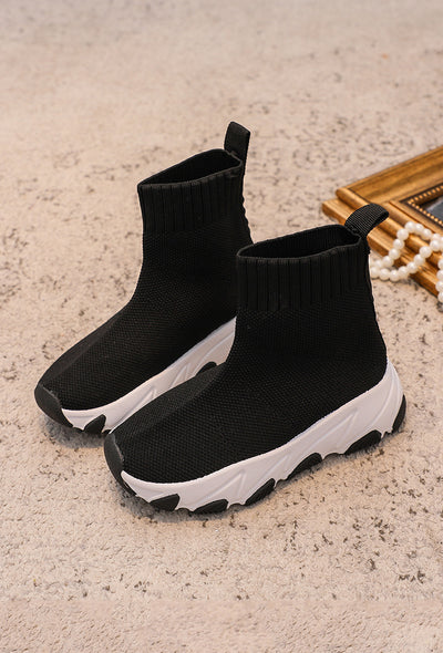 <p data-mce-fragment="1">Introducing Rock &amp; Joy's designer inspired girls black trainers with a white chunky sole, perfect for the spring/summer season. These ankle height trainers feature a comfortable sock material that will keep your little one's feet stylish and supported all day. Upgrade her shoe game with these trendy trainers.</p>
