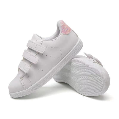 <p data-mce-fragment="1">These girls white &amp; pink velcro strap trainers are part of the spring summer collection from the Rock &amp; Joy brand. Featuring a velcro fastening for easy wear, these trainers are perfect for active girls. The pink detail on the back adds a fun touch to these comfortable and durable shoes.</p>