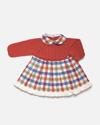 Introducing the perfect piece for your little girl this winter: the Juliana girls dark orange checked print dress. This knitted dress is finished in a warm, dark orange colour, complete with a check print design. Available in sizes 3 months to 4 years old, it's the perfect combination of style and comfort.