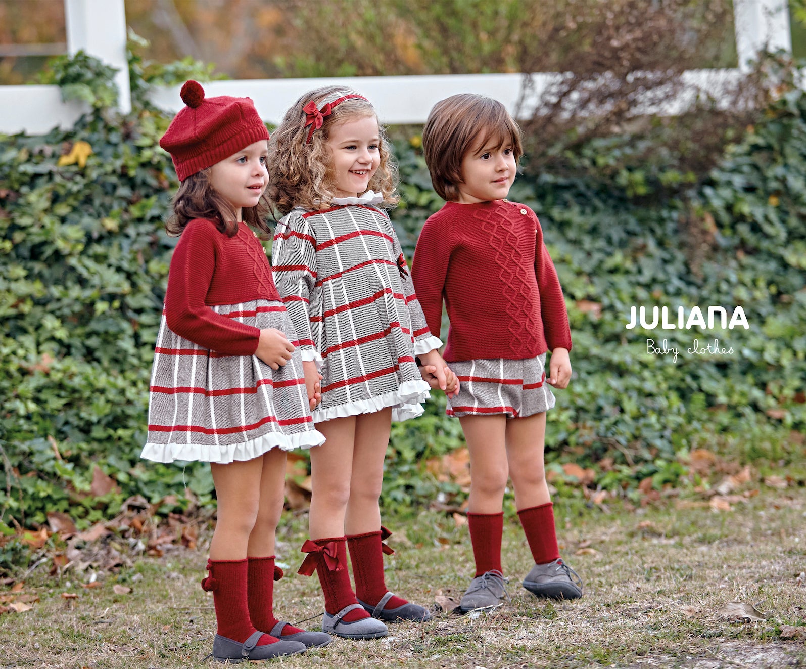 This Juliana branded dress is perfect for keeping your little one warm in the winter. It is finished in a red and black checked design, with a white frill collar and a small red bow to the side. It features a button fastening on the reverse, available in sizes 3 months up to 4 years old.
