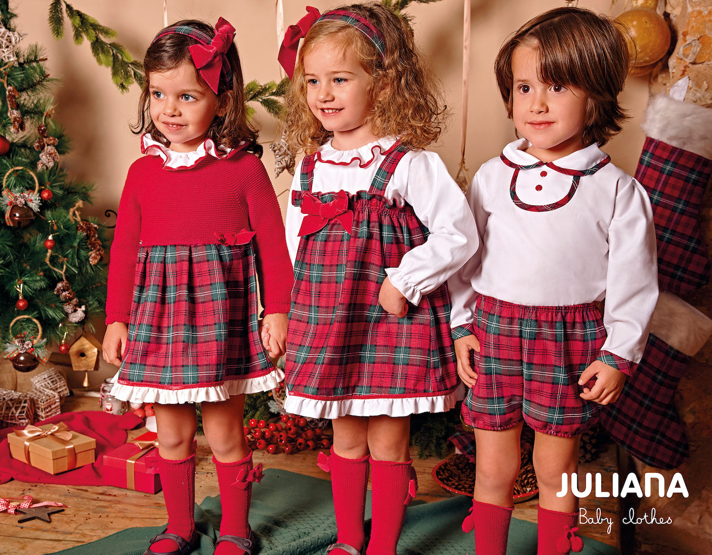 This Juliana branded two-piece outfit is perfect for any stylish boy. The white shirt features a peter pan collar with red and green checked piping on the cuffs and collar, while the matching shorts come in a chic red and green check pattern. Available in sizes 3 month to 4 year.