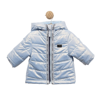 Mintini Baby branded boys padded winter coat finished in a sky blue colour. This boys puffer coat has a hood and grey Mintini branded design going down the middle, and has zip fastening. Available in sizes 3 month up to 24 month.