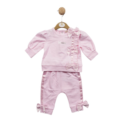 Mintini Baby branded girls two piece jogger set finished in a soft pastel pink colour. This girls outfit consists of a long sleeve sweatshirt, with a round neck collar, which has silk bow detail going doing the side on the front. It also comes with jogger trousers to match, which have bow detail on the ankle. Available in sizes 3 month up to 24 month.