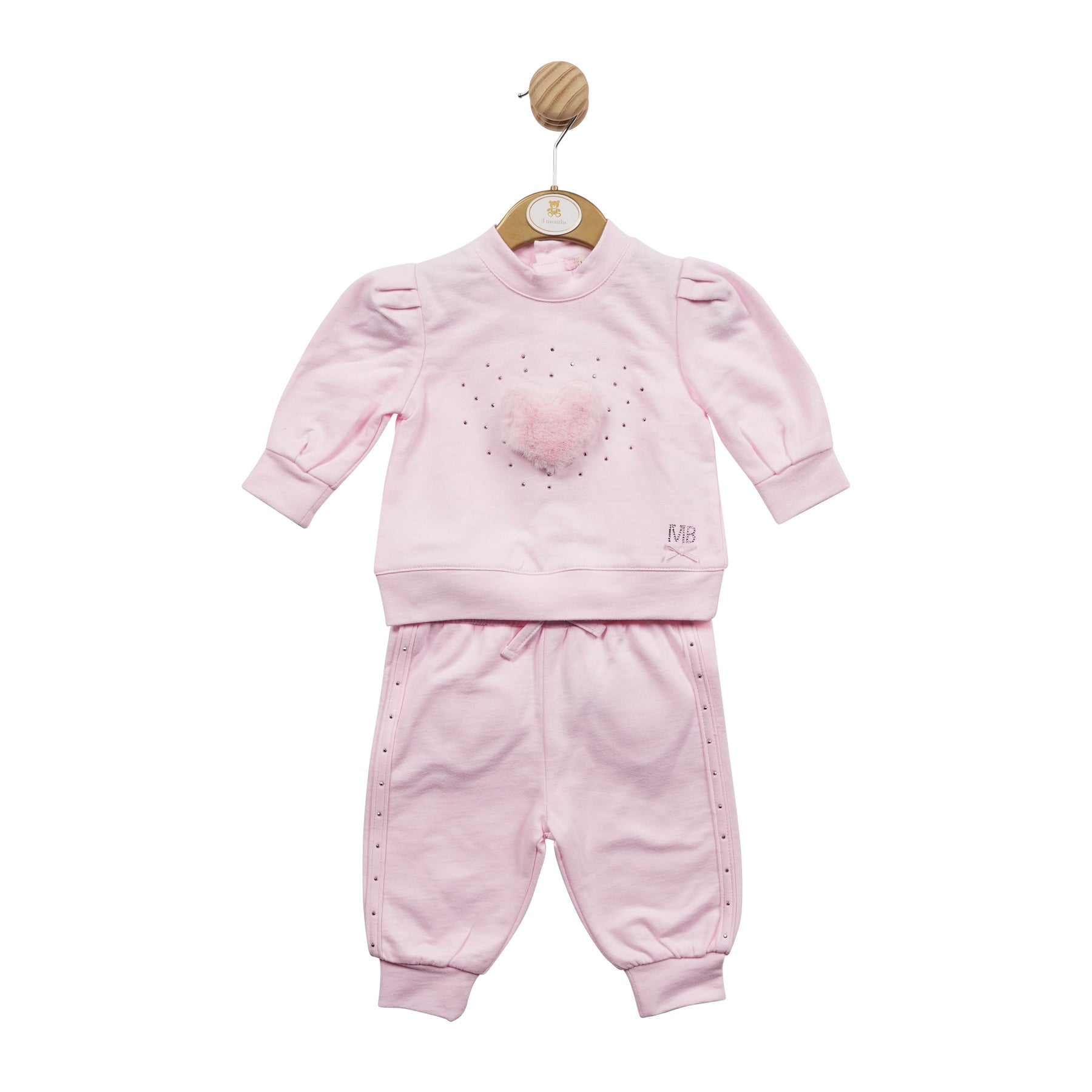 Mintini Baby, girls pink two piece jogger set, set consists of a long sleeve sweatshirt with heart shape fur detail and diamanté sequins, trousers have heart shape detail on the back, available in sizes 3 month up to 24 month