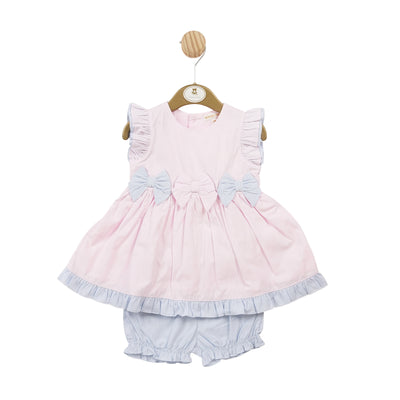 <p>This baby boutique summer outfit by Mintini Baby features a playful combination of pink and blue. The dress and bloomer shorts are designed for girls and include a charming three bow detail across the front. Available in sizes 3 months up to 24 months.</p>