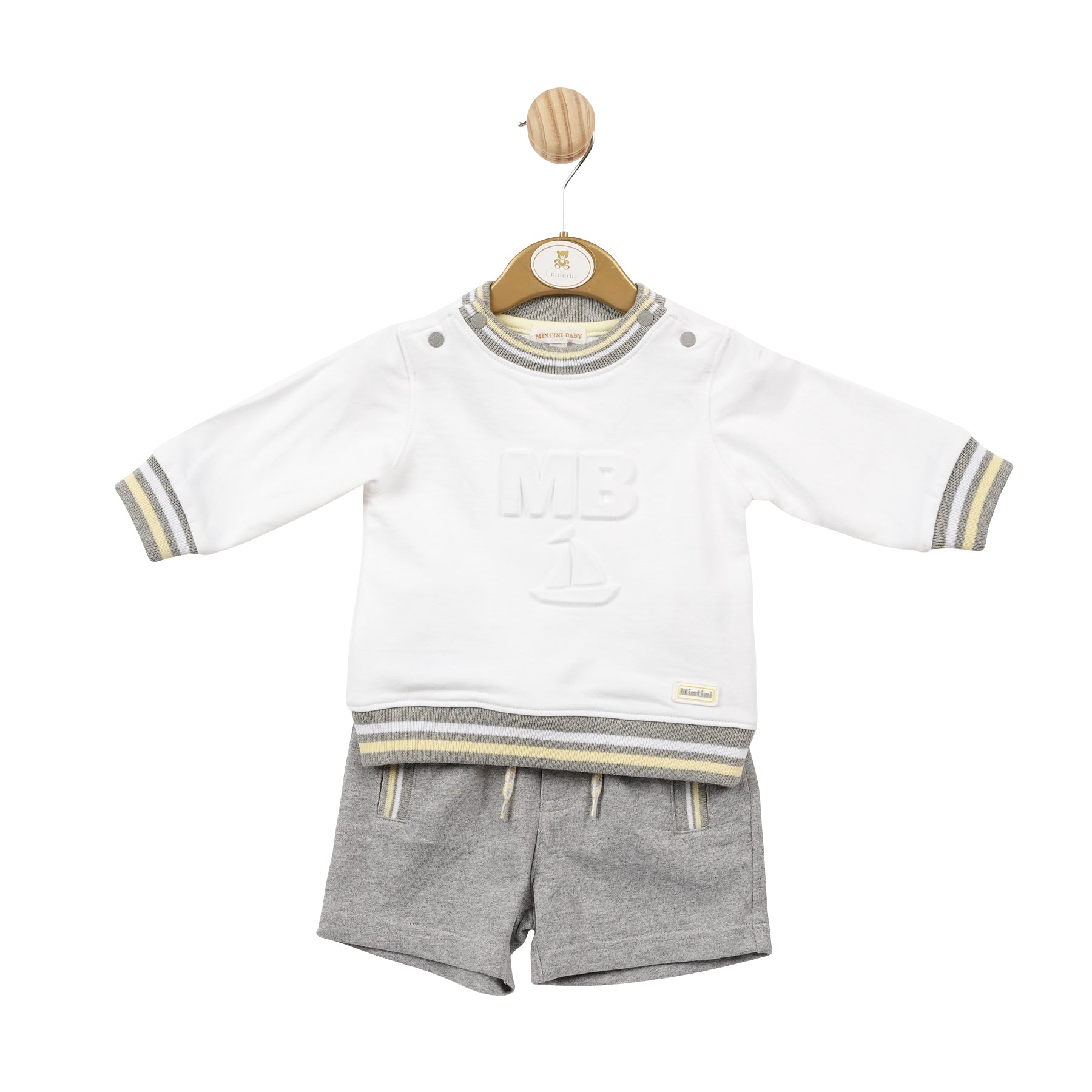 <p>This boys two piece set from Mintini Baby is perfect for the spring and summer season. The white sweatshirt features a stylish MB logo in the middle with grey and yellow piping detail, while the grey shorts have a pop of colour with yellow piping detail. Available in sizes 3 months up to 5 years old. Perfect if you want to match little brother with big brother.</p>