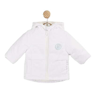 Introducing our boys white hooded winter coat from Mintini Baby's autumn winter collection. Keep your little one warm and stylish with this hooded coat featuring the M logo on the chest, pocket detail, and zip up fastening. Available in sizes 3 months to 5 years.