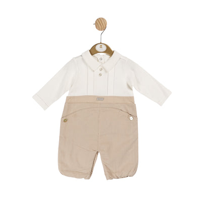 This Mintini Baby boys ivory and beige long sleeve romper features a pleated design on the shirt and collar detail, paired with pockets on the legs. Available in sizes 3 months up to 12 months, this stylish romper offers comfort and convenience for your little one.