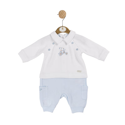 Introduce your young child to our boys white &amp; blue long sleeve romper with bicycle detail, designed by baby boutique brand, Mintini Baby. Perfect for the autumn and winter months, this romper showcases a delightful bicycle design on the front. The shoulder buttons add a touch of charm to the design, it comes in a range of sizes from 3 to 12 months.