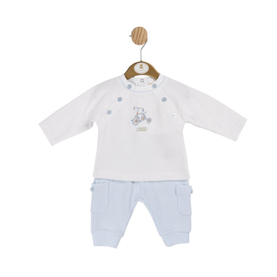 Introducing our new arrival from Mintini Baby, this boys white &amp; blue two piece bicycle motif outfit. Perfect for the autumn winter season, this set includes a white long sleeve top with a charming bicycle motif and blue elasticated trousers with pocket detail. Available in sizes from 3 months to 24 months.