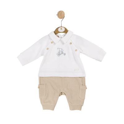 Introducing the boys beige bicycle romper by Mintini Baby. This long-sleeved and trouser romper features a charming bicycle motif on the front and button design on the side. Available in sizes 1 month to 6 months, it is perfect for your little boy's stylish and comfortable wardrobe.