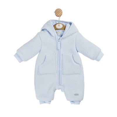 Experience the ultimate autumn/winter essential with our boys blue towelling all in one by Mintini Baby. This snug and fashionable garment ensures optimal warmth for your infant in luxurious towelling material, equipped with a zip closure, front pockets, and charming hood adorned with sweet little ears. Avaialble in sizes 3 up to 12 months.