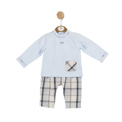 Introducing the Mintini Baby ivory &amp; blue check top and trouser set for boys, part of our new autumn winter collection. This two-piece outfit features a round neck blue top with an ivory and navy check design pocket to the front side, paired with matching ivory and navy checkered trousers. Available in sizes 3 months to 24 months.