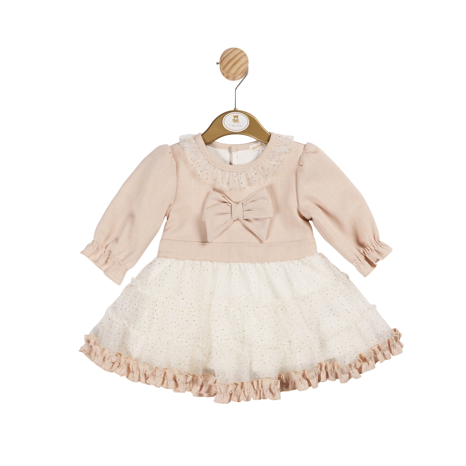 Add a touch of elegance to your little girl's wardrobe with our girls beige, ivory & gold dress. This Mintini Baby branded dress features a beautiful large bow design, gold detailing, and long sleeves for a timeless look. Perfect for any special occasion, from Christmas to birthdays. Available in sizes from 3 months up to 24 months.