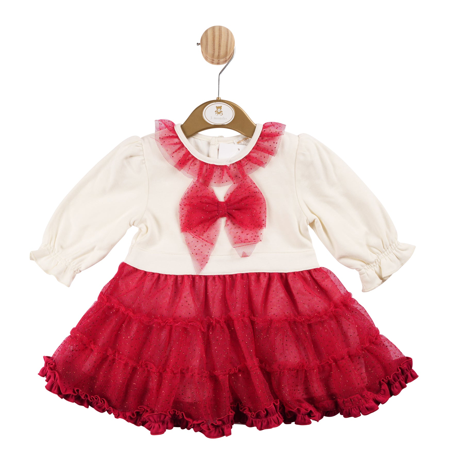 Introducing the Mintini Baby girls ivory & red dress! A new arrival in our autumn winter collection, this dress is perfect for the holiday season with its festive colours and frill lace detail around the collar. The adorable bow on the front adds a touch of charm. Available in sizes 3 months to 24 months.