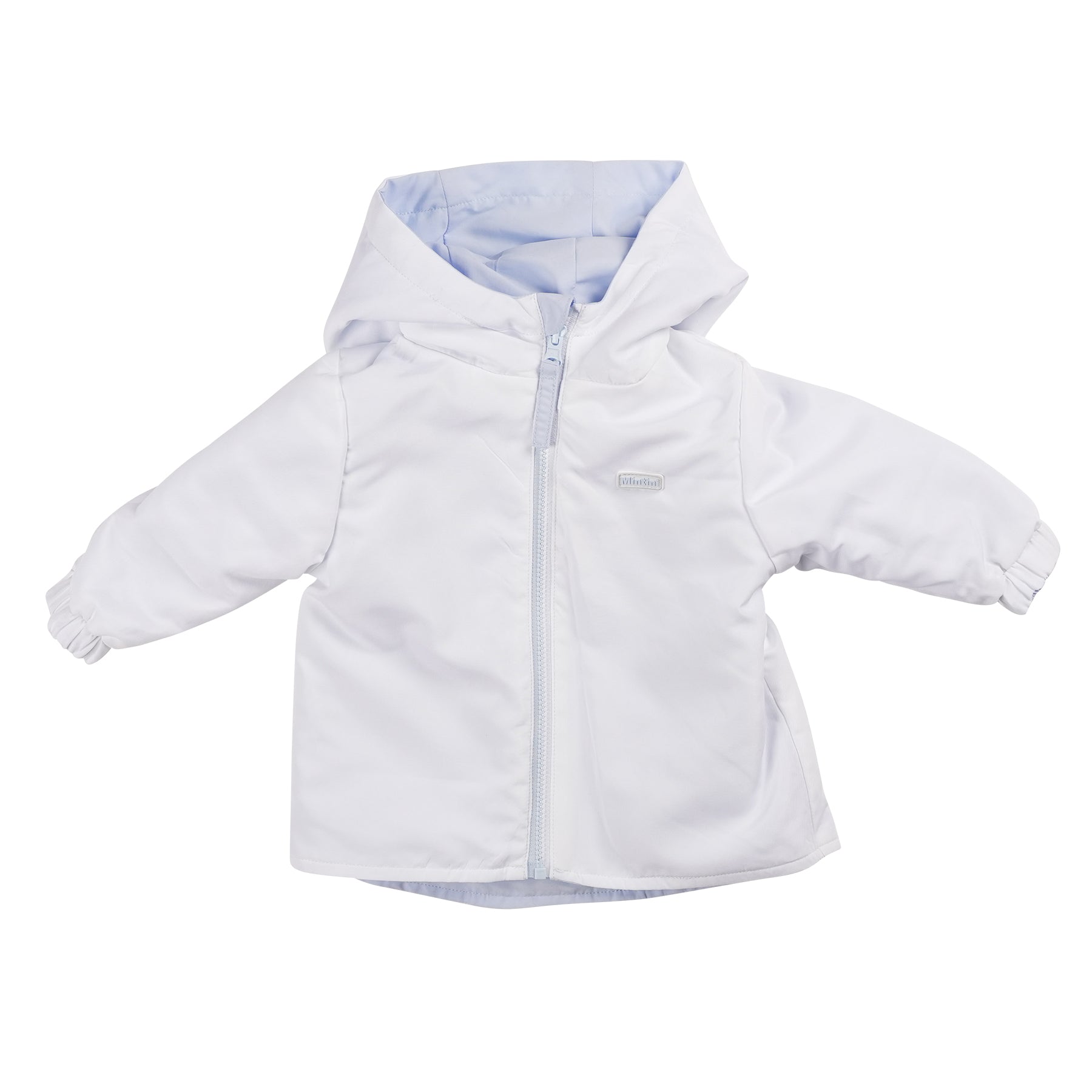 This boys 2-in-1 hooded summer coat from Mintini Baby boasts a reversible design, it is blue on one side, and turn it inside out and it is white, it is perfect for versatile styling. Made from lightweight fabric, it's ideal for the warm weather and is available in sizes 3 months up to 5 years old. Easily match siblings with this stylish spring summer collection piece.