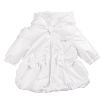 This girls white lightweight hooded summer coat from Mintini Baby is perfect for your little girl's spring and summer wardrobe. The white colour is versatile and the lightweight design is ideal for warmer weather. It features two bows on the front and one on the back, adding a touch of charm. With a zip up fastening and available in sizes 3 months to 5 years, this coat is perfect for matching sisters.