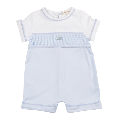 This Mintini Baby romper, available in sizes 3-12 months, features a round neck collar, button fastening, and blue band detail for a stylish look. The white and blue design is perfect for baby boys, and the short sleeves provide comfort and ease of movement. It also has a touch of sophistication with blue piping around the neck and arms.