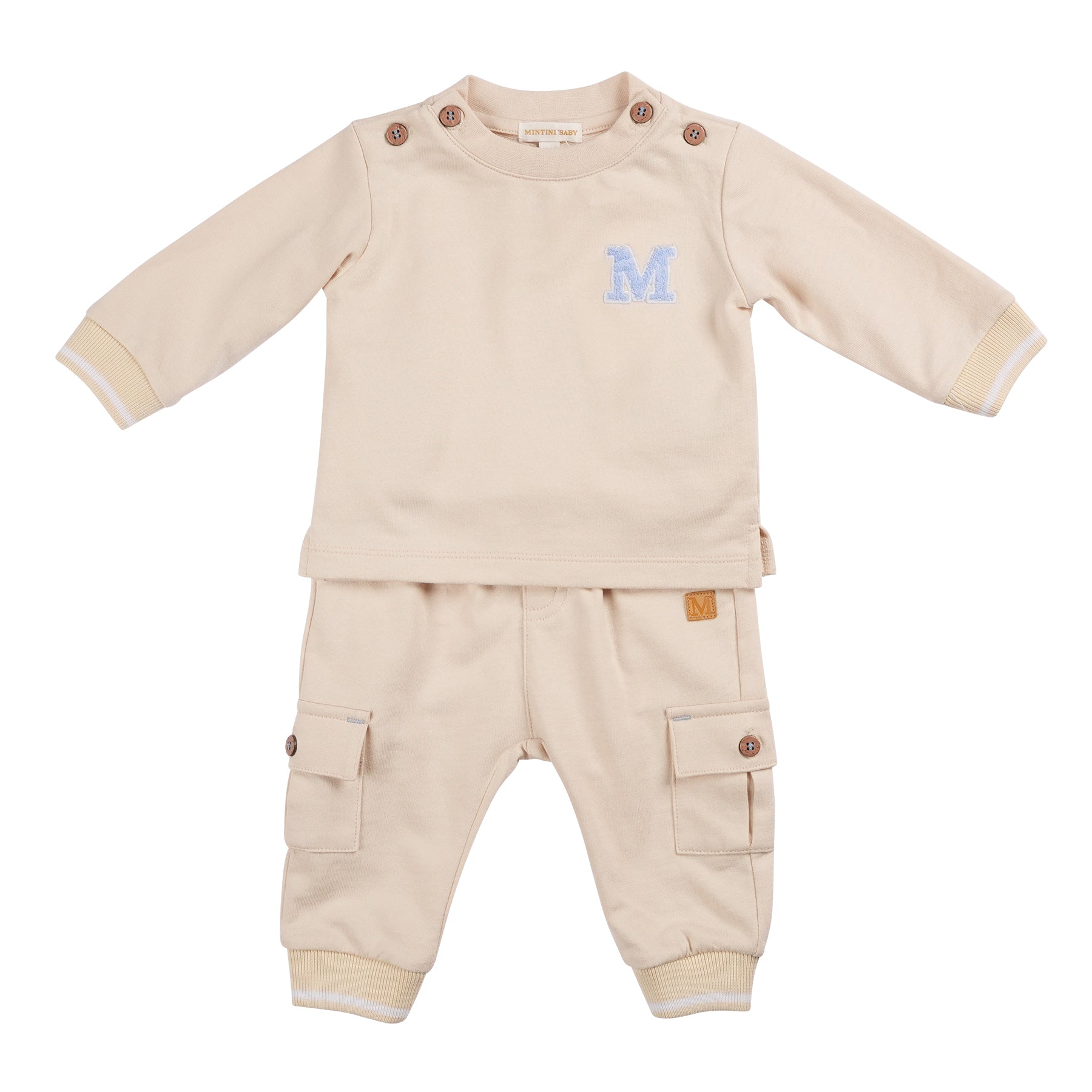 Perfect for matching little brother with big brother, this Mintini Baby two piece jogger set is a must-have for boys. The beige long sleeve top features an M logo, while the cargo style jogger trousers offer both style and comfort. Available in sizes 3 months to 5 years.