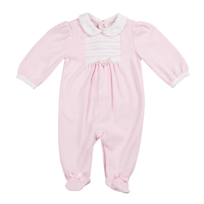 Get your baby girl ready in this beautiful pastel pink all in one sleeper by baby boutique brand, Mintini Baby. The charming white collar, small white box design and bow add a fashionable touch, while the push button fastening allows for effortless dressing. Available in sizes 1 month, 3 months, and 6 months.